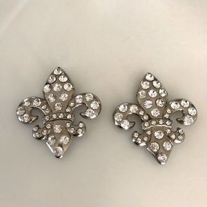 Beautiful silver metal fleur-de-lis encrusted with clear rhinestones